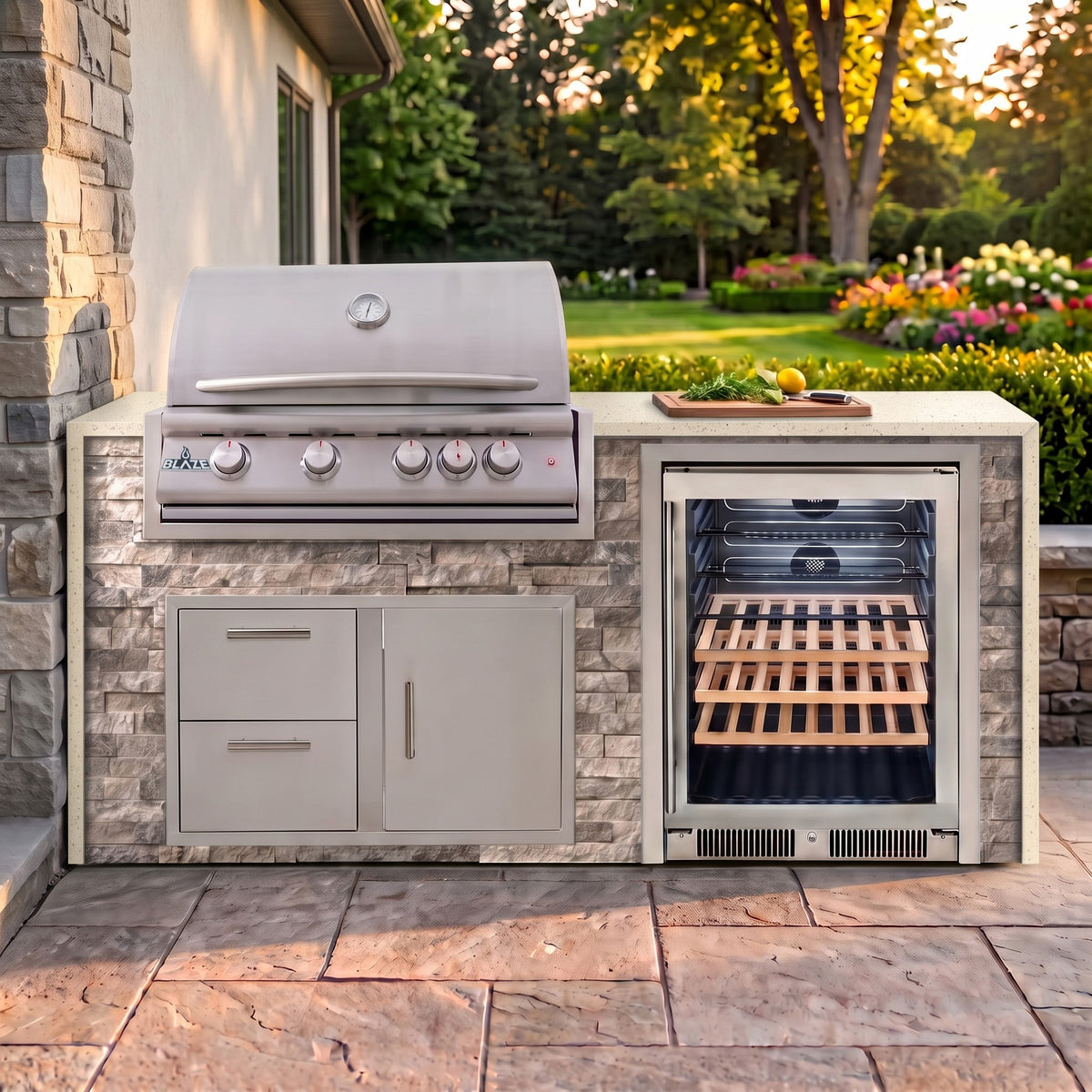 Tuscan Hearth outdoor kitchen with Frosted Ember granite countertop on a stone paver patio beside a backyard garden