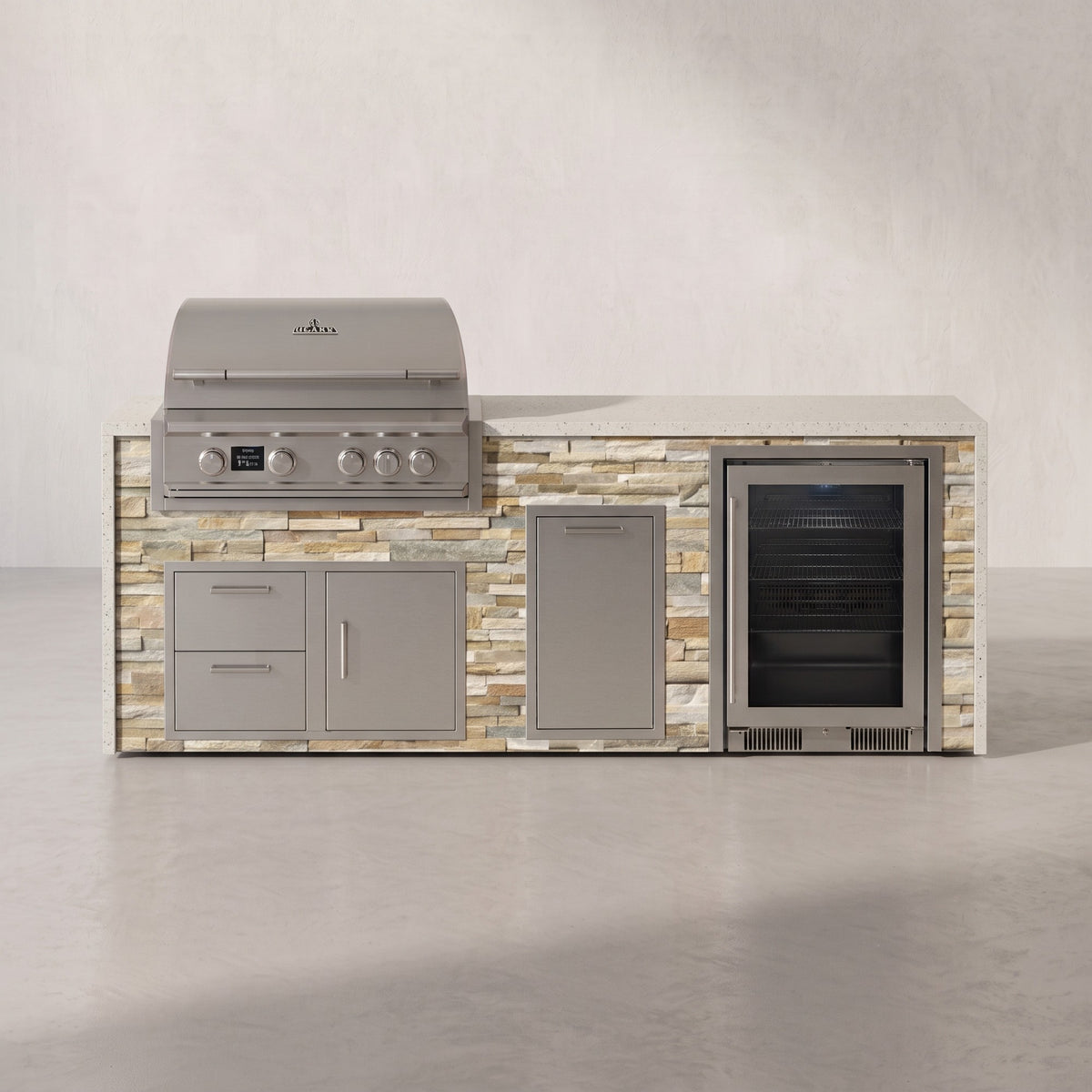 Big Ridge 8 ft Blaze waterfall outdoor kitchen with beverage cooler in Sunkissed Dune stacked stone with Frosted Ember granite