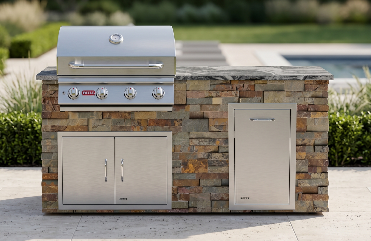 Bull outdoor kitchen island in gold toned stacked stone with a built in grill and stainless doors