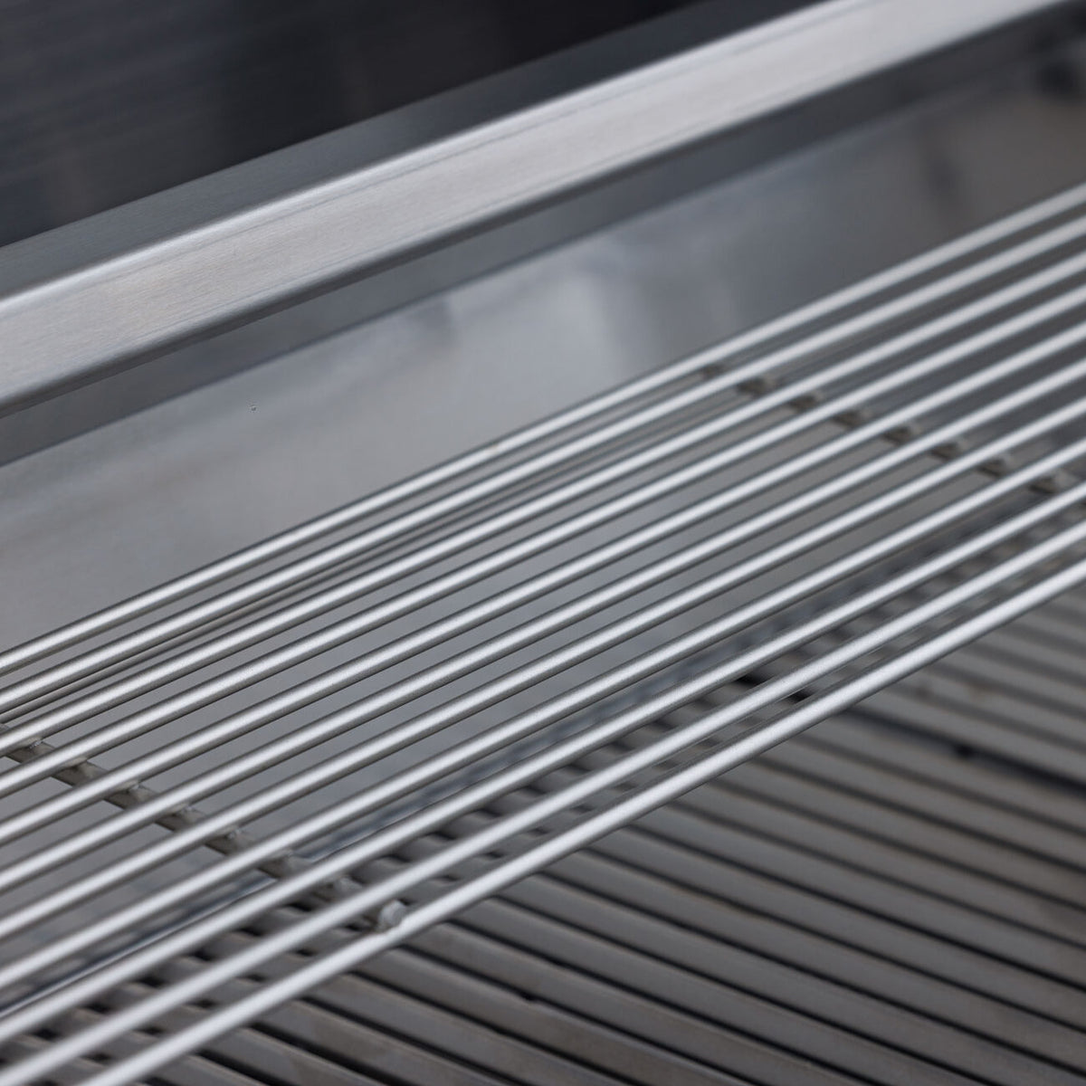 Triangular stainless cooking rods on the Blaze BCM grill