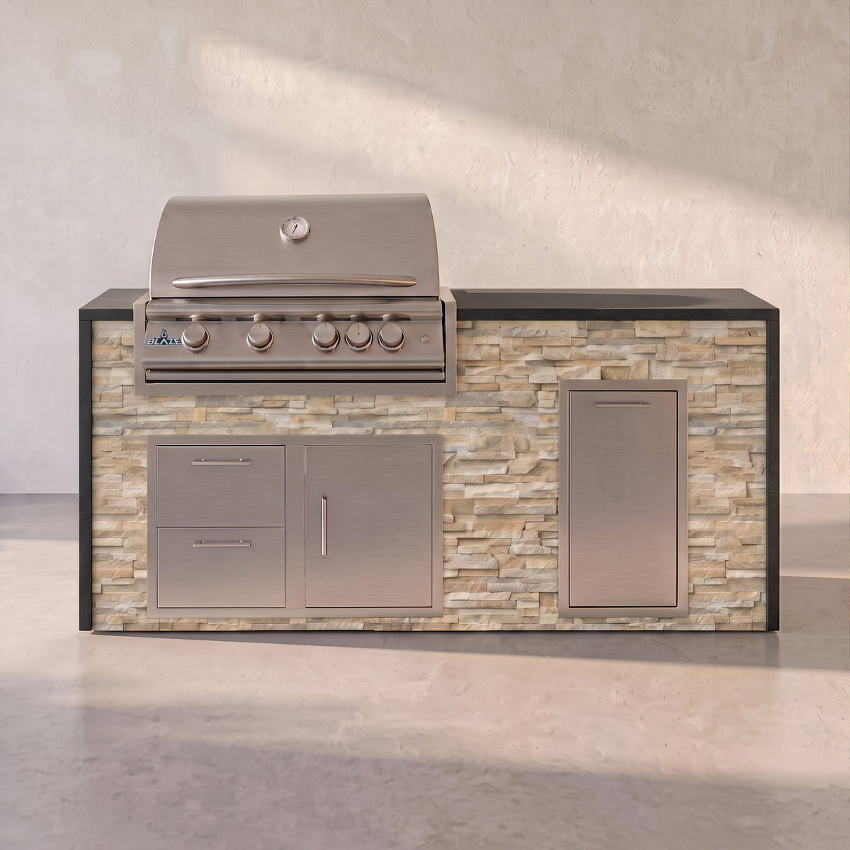 Big Ridge 6 ft Blaze waterfall outdoor kitchen with trash drawer in Sunkissed Dune stacked stone with Charred Onyx granite