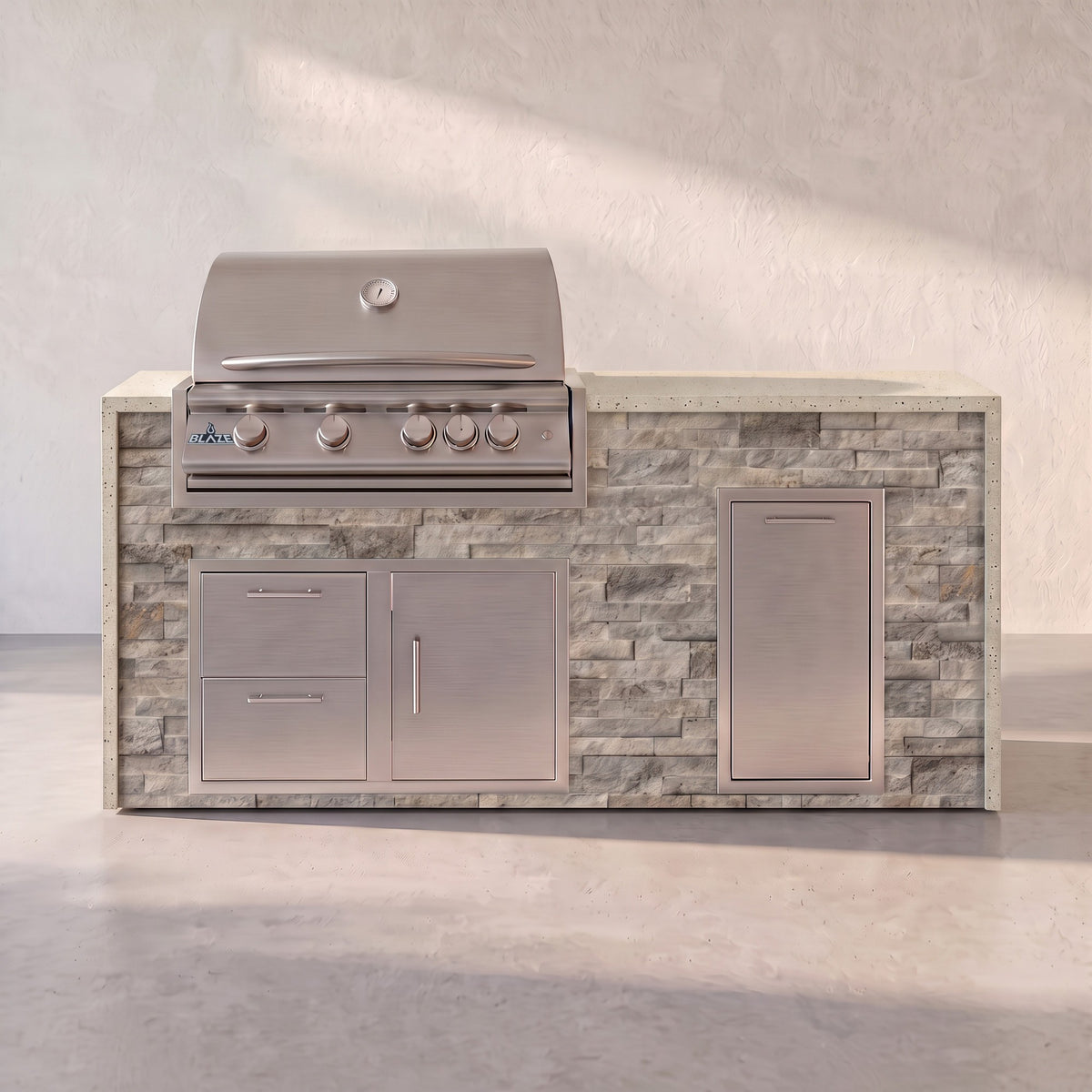 Big Ridge 6 ft Blaze waterfall outdoor kitchen with trash drawer in Tuscan Hearth stacked stone with Frosted Ember granite
