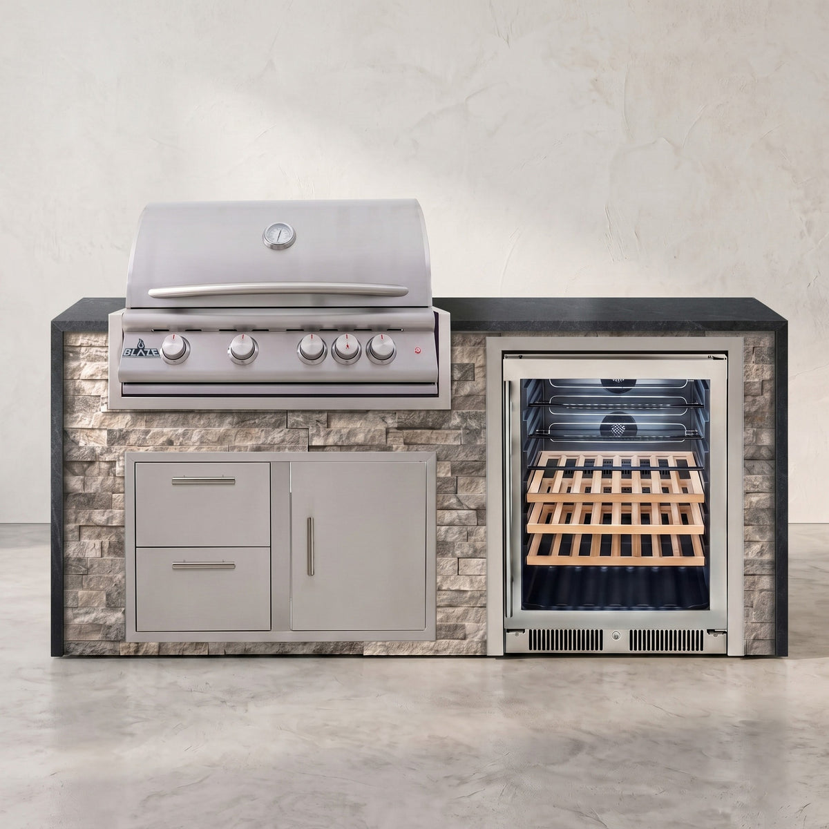 Big Ridge 6 ft Blaze waterfall outdoor kitchen in Tuscan Hearth stacked stone with Charred Onyx granite