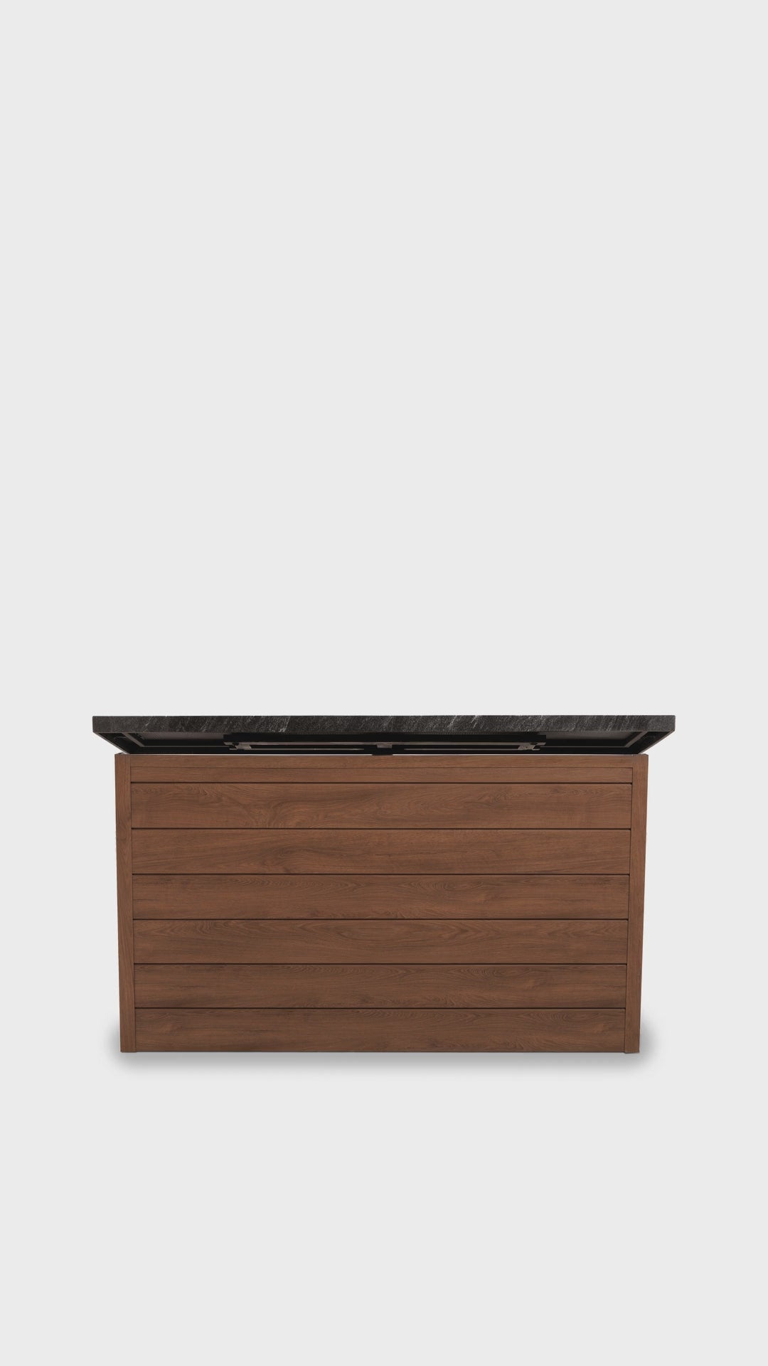 Outdoor TV lift cabinet raising the TV for game day on a backyard patio, swiveling to face the seating and lowering it back into the cabinet